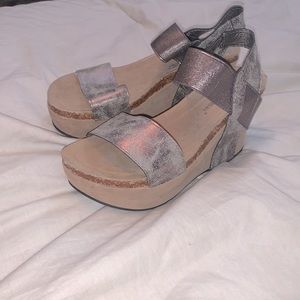They are a tan color with silver/grey straps and are sandal wedges